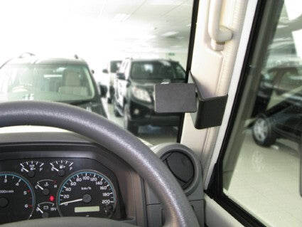 Car interior with steering wheel and dashboard with ClicOn Dash Mount