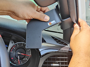 Person installing ClicOn Dash Mount on right side