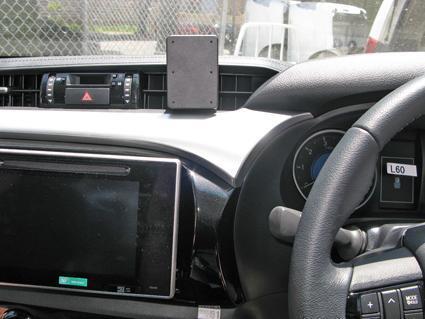 Car interior with dashboard, steering wheel, and ClicOn Dash Mount