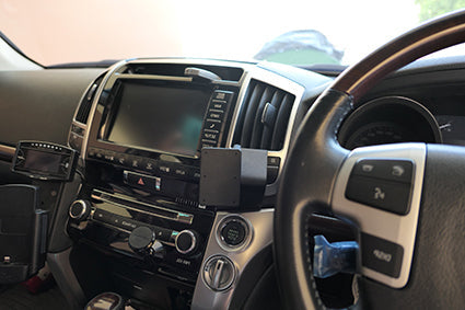 Car interior with ClicOn Dash Mount and steering wheel visible