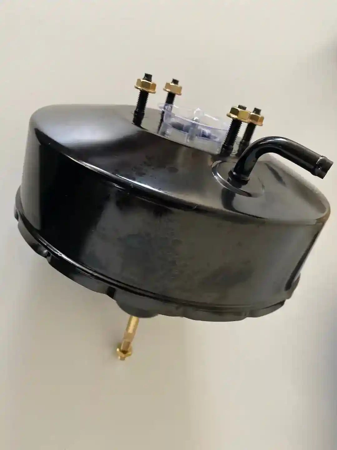Power Brake Booster with brass fittings on a white background