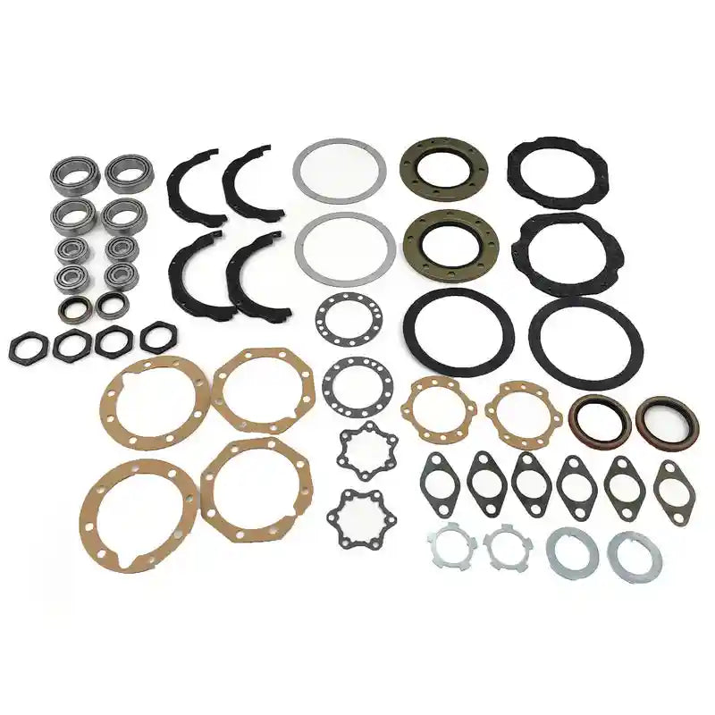 Collection of mechanical parts including bearings, washers, and gaskets on a white background