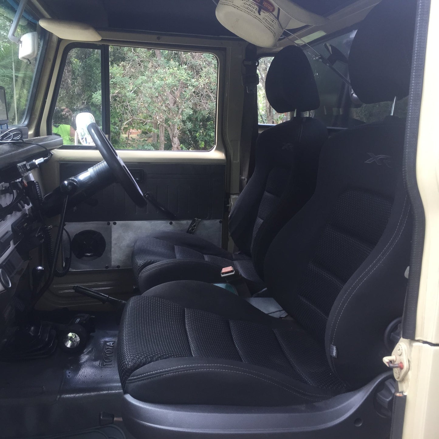 Interior of a vehicle with black seats and Seat Adapter Kit