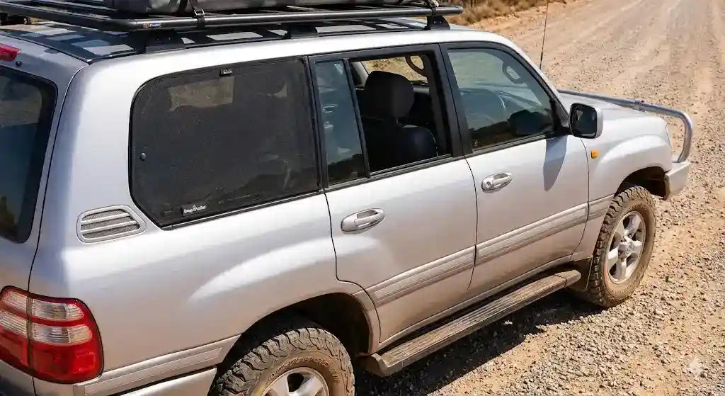 Snap Shades magnetic window shade installed on Toyota LandCruiser 100 Series rear door