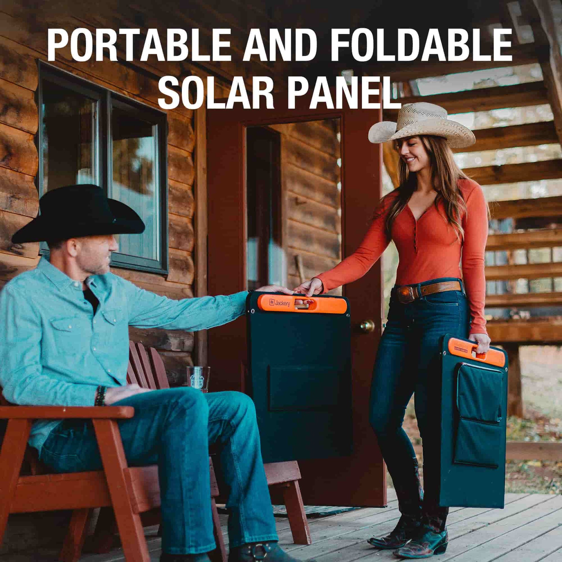 Man and woman with portable foldable solar panels in front of a wooden cabin.