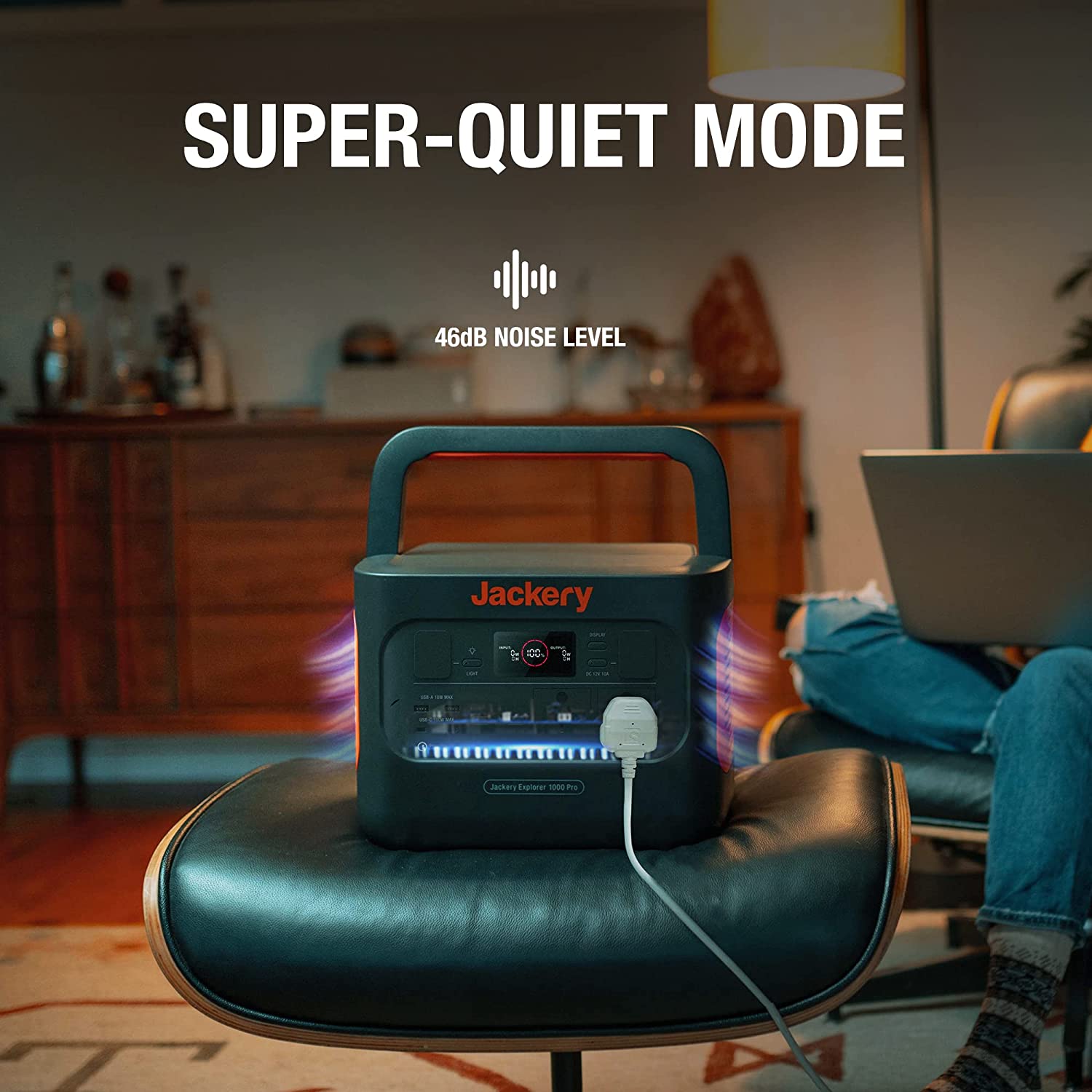 Jackery portable power station with 'Super-Quiet Mode' text in a living room setting.