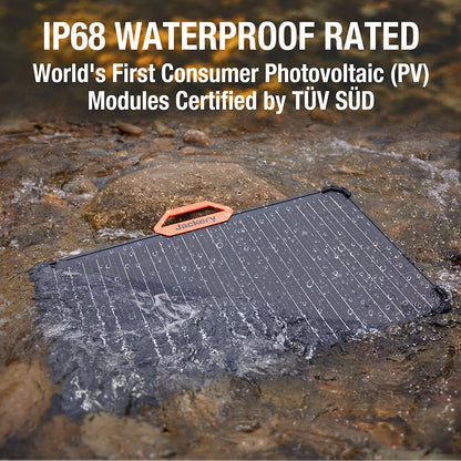 Solar panel on a rocky surface with water droplets, labeled as IP68 waterproof rated and certified by TÜV SÜD.
