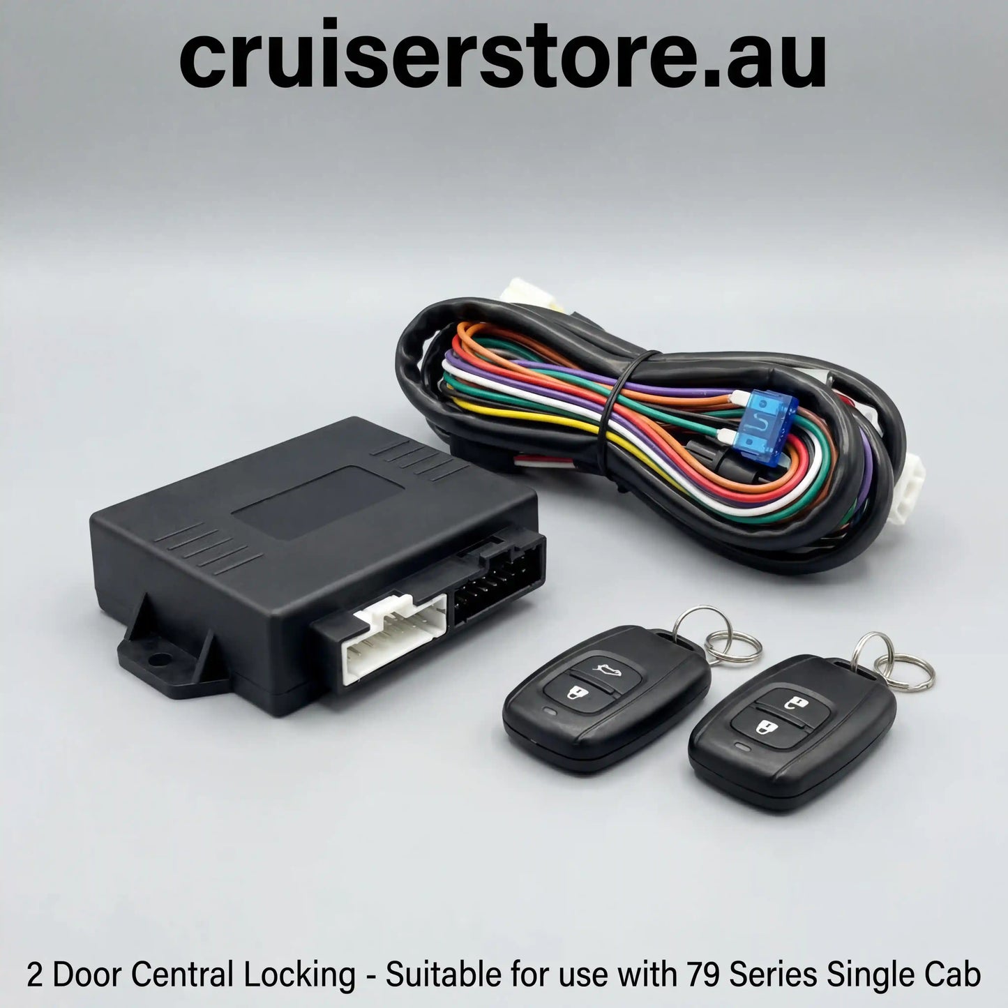 2 door central locking kit with control box, key fobs and wiring harness for LandCruiser 79 Series single cab on a white background