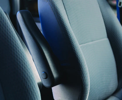 Close-up of a car seat with a focus on the Dual Folding Armrest Kit