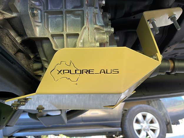 Yellow undercarriage guard with 'Xplore Aus' branding on a vehicle.