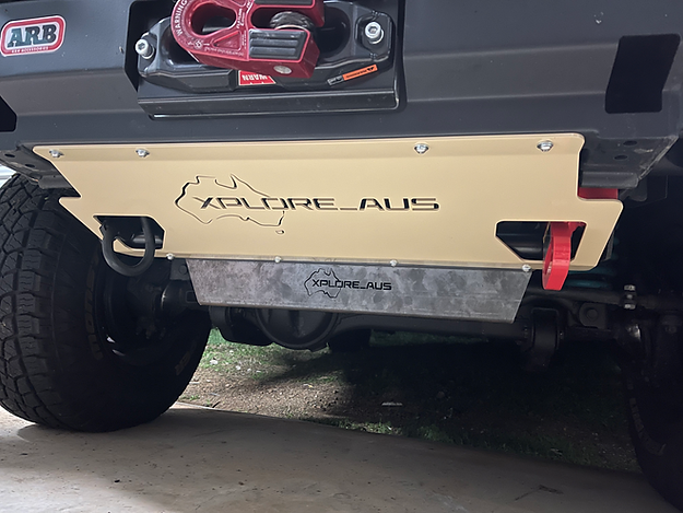 Close-up of a vehicle's Radiator Protector with 'Xploreraus' branding.