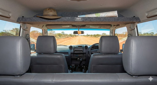 Interior view of Toyota LandCruiser 79 Series with 4WD Interiors Top Shelf installed above the windscreen.