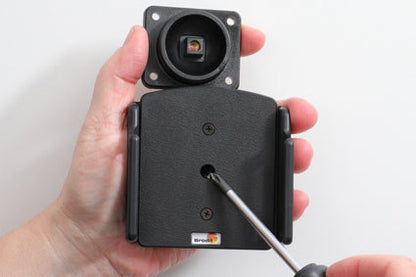 Hand holding a black Phone Holde with a screwdriver on a white background