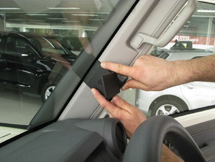 Person installing ClicOn Dash Mount 