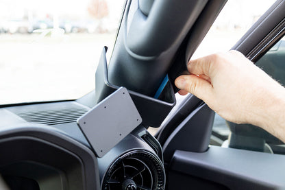 Hand adjusting a ClicOn Dash Mount