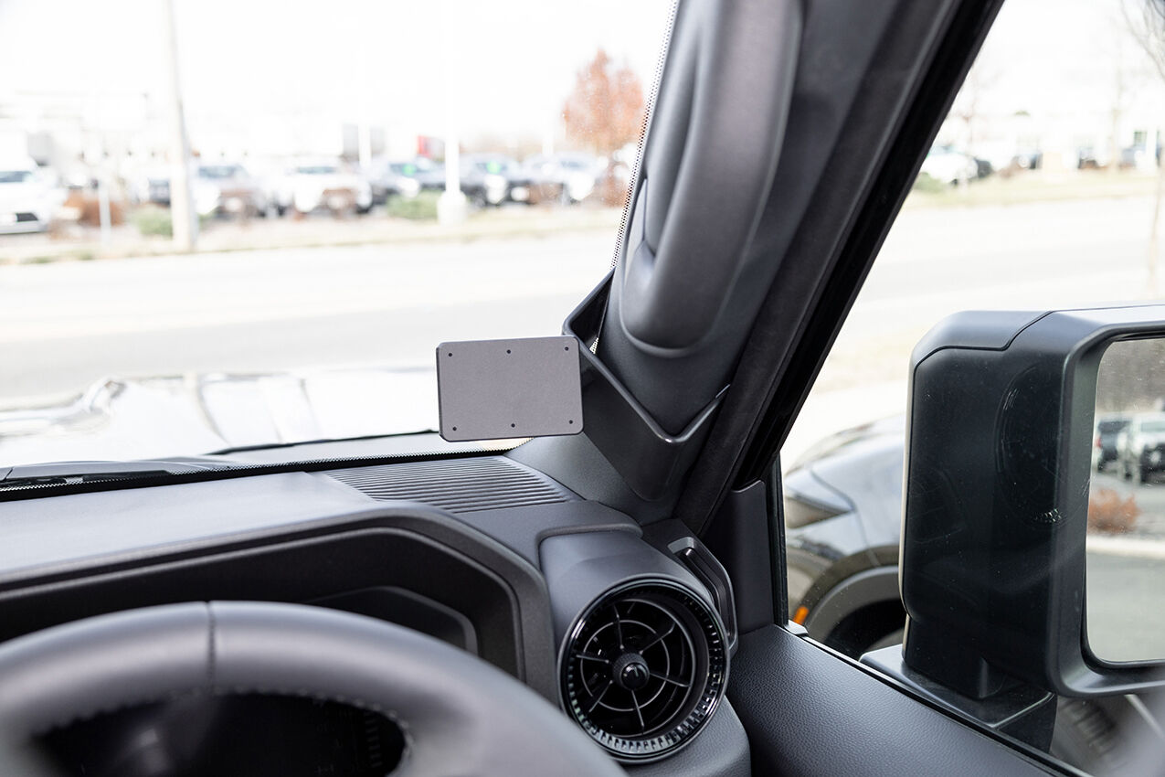 Car interior with a mounted ClicOn Dash Mount on dashboard.