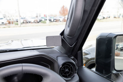 Car interior with a mounted ClicOn Dash Mount on dashboard.
