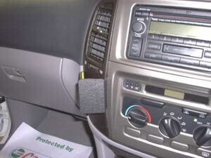 Car dashboard with radio and climate control knobs, featuring a Dash Mount