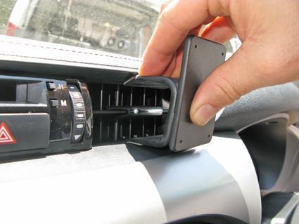 Hand adjusting a ClicOn Dash Mount