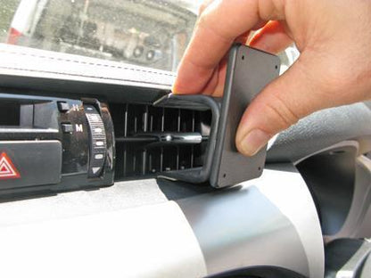 Hand adjusting a ClicOn Dash Mount