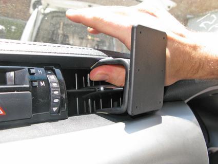 Hand holding a ClicOn Dash Mount