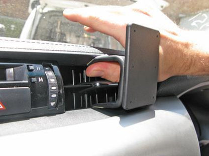 Hand holding a ClicOn Dash Mount
