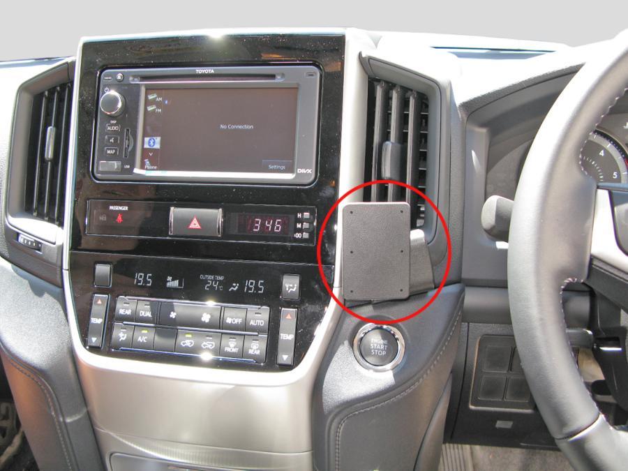 Car interior with dashboard display and air vent, showing a ClicOn Dash Mount