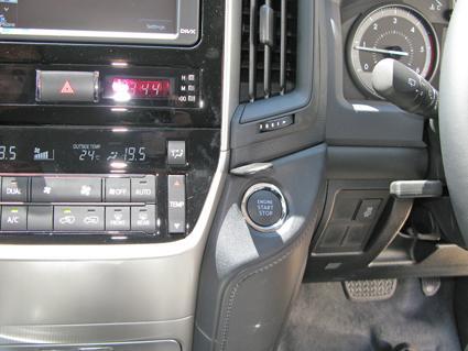 Car interior with dashboard controls and climate settings.