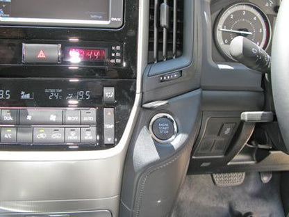 Car interior with dashboard controls and climate settings.