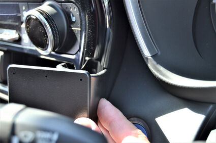 Person installing ClicOn Dash Mount