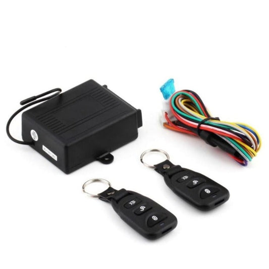 Car alarm system with black control box, two key fobs, and wiring harness on a white background