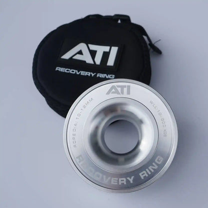 Silver ATI Recovery Ring with black pouch on a light gray background