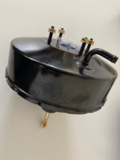 Power Brake Booster with brass fittings on a white background