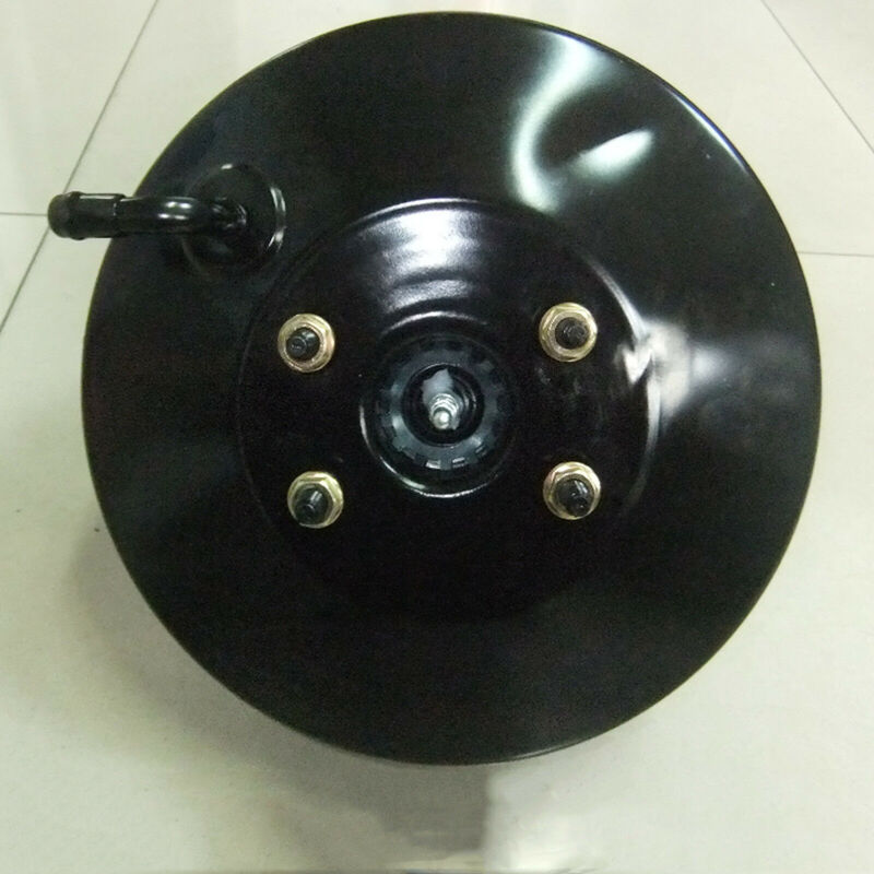 Power Brake Booster with bolts on a white tiled floor