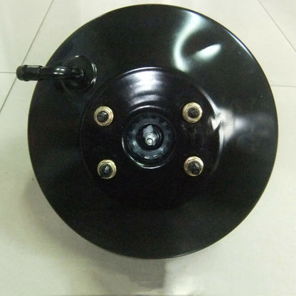 Power Brake Booster with bolts on a white tiled floor
