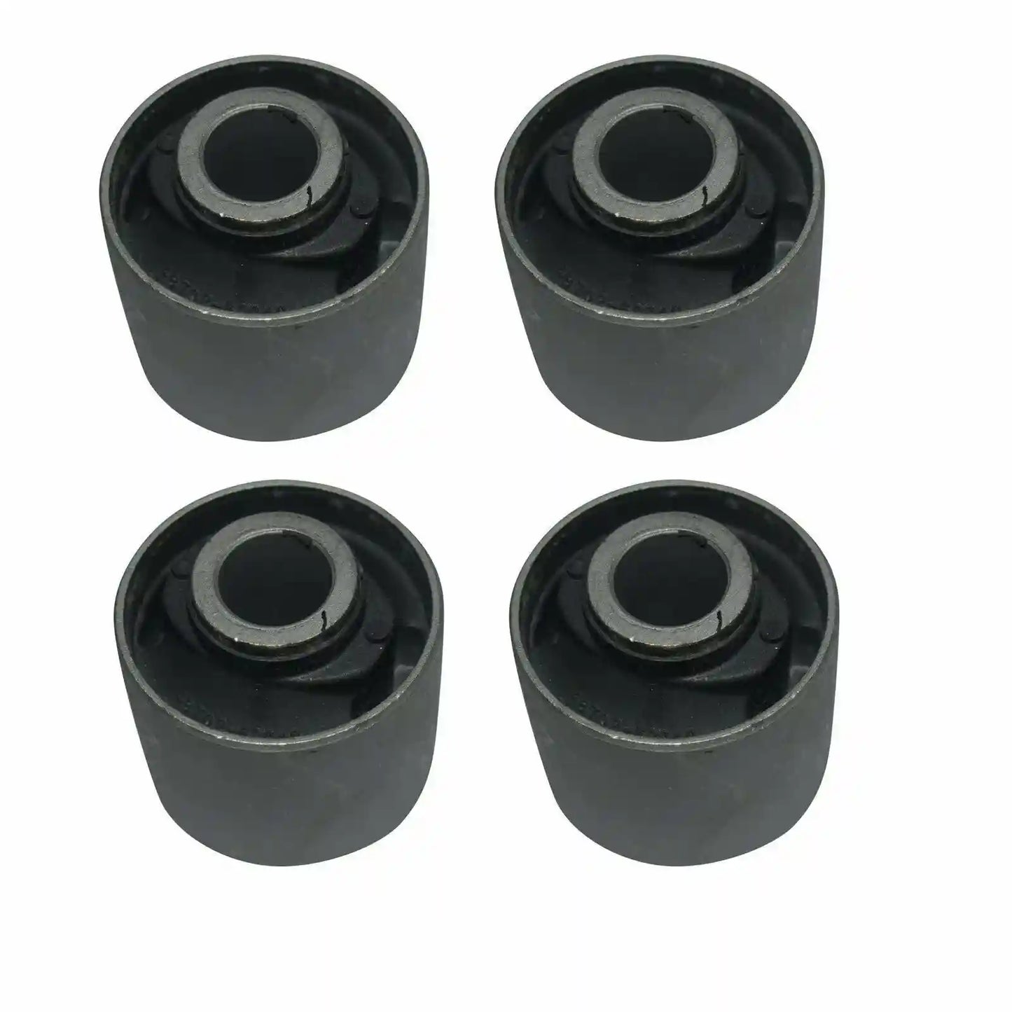 Four black cylindrical rubber bushings on a white background