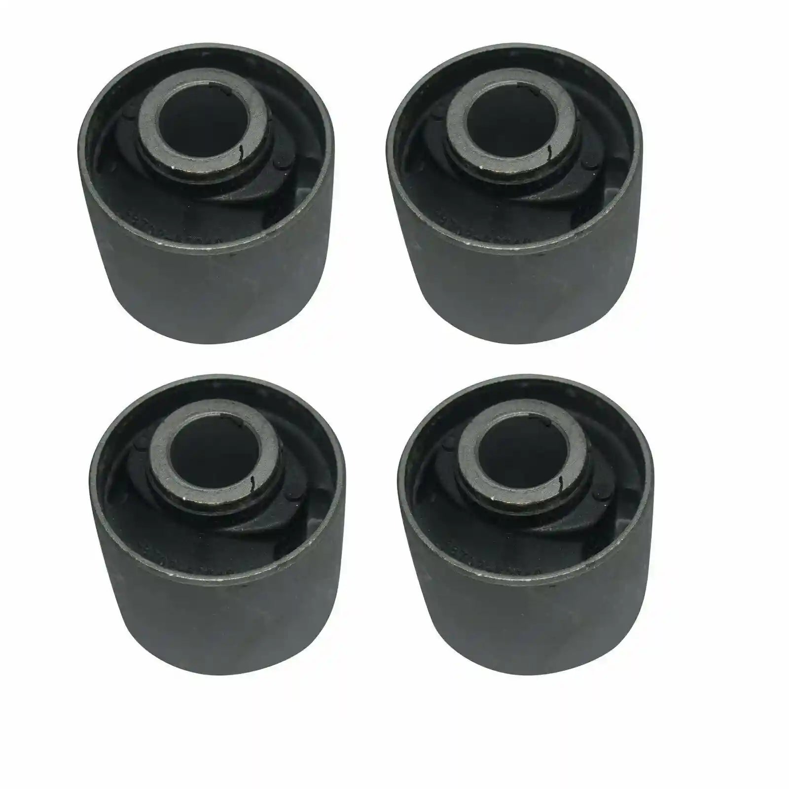 Four black cylindrical rubber bushings on a white background