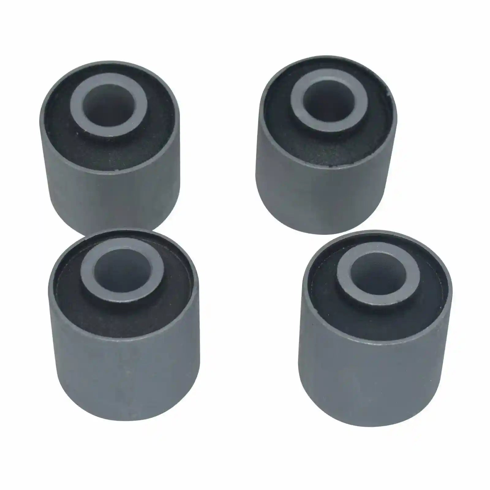 Four gray rubber bushings on a white background