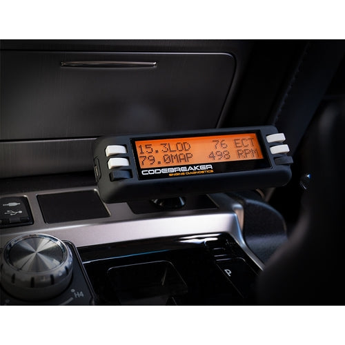 Car dashboard with a 4 Mode OBD2 Computer, branded 'Codebreaker'.