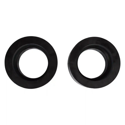 Two black front coil spring spacers