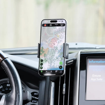 Phone mounted on a car dashboard with a map application displayed