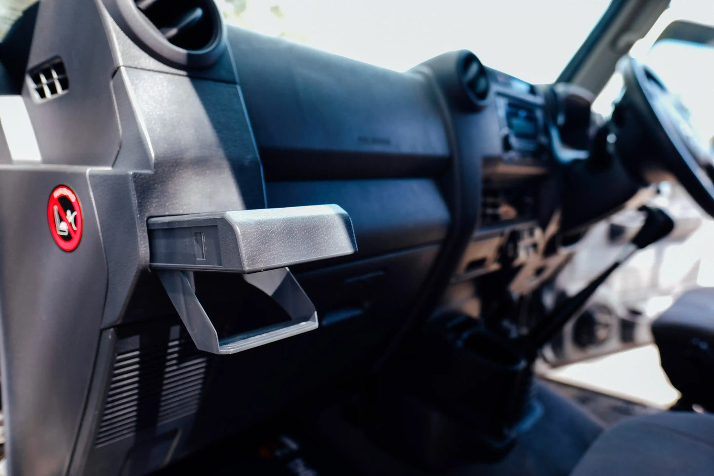 Close-up of a car's interior with a focus on the dashboard and steering wheel.