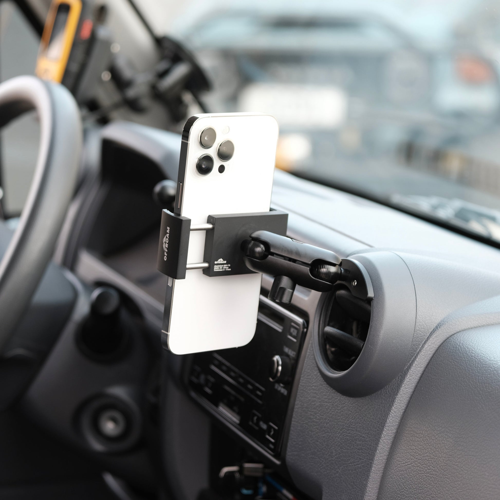 Phone mounted on a car holder inside a vehicle