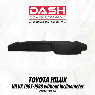 Black car dashboard cover for Toyota Hilux on a white background with Dash Cover Company branding.