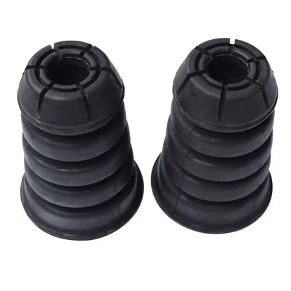 Two black rubber bushings on a white background