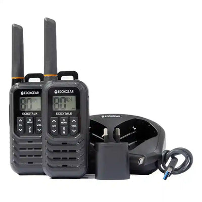 Two UHF Radios with a charger on a white background