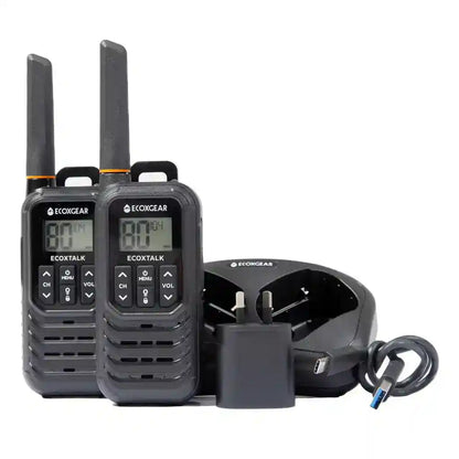 Two UHF Radios with a charger on a white background