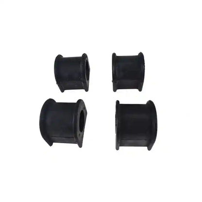 Four black rubber bushings on a white background