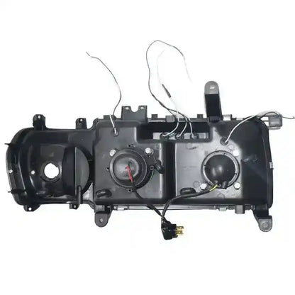 Car headlight assembly with wiring on a white background