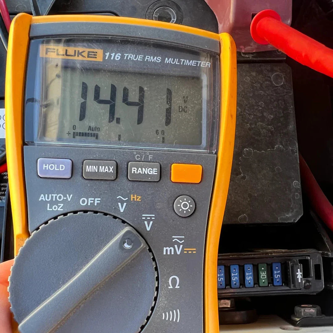 Fluke multimeter displaying a reading of 14.41 DC